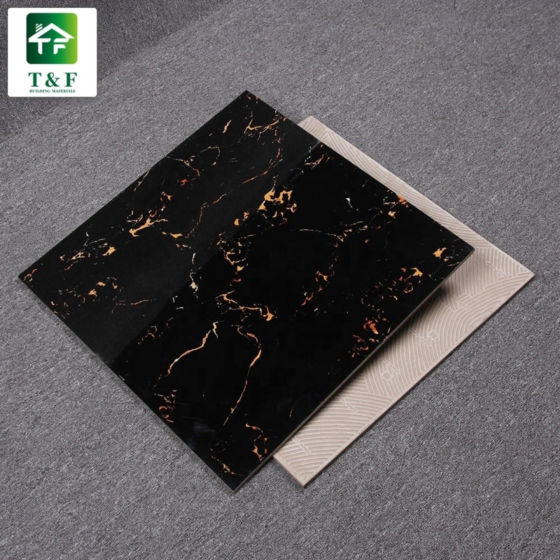 艶をかけられた磨かれた磁器の床タイル600x600の黒および金の花色